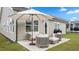 Inviting outdoor patio area with seating, umbrella, and grill at 1633 Hillstar St, Fuquay Varina, NC 27526