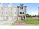Charming new construction townhome featuring a brick and siding facade and an attached one car garage at 1921 Fishamble St # 13, Fuquay Varina, NC 27526