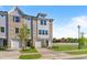 Charming new construction townhome featuring a brick and siding facade and an attached one car garage at 1921 Fishamble St # 13, Fuquay Varina, NC 27526