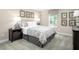 Bedroom featuring neutral walls, carpet, paisley comforter, and two side tables with lamps at 196 Glen Hollow Dr, Raleigh, NC 27604