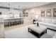 Open-concept living space with modern kitchen, featuring a spacious seating area with neutral décor at 196 Glen Hollow Dr, Raleigh, NC 27604