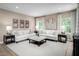 Bright and spacious living room featuring neutral decor and ample seating for entertaining at 196 Glen Hollow Dr, Raleigh, NC 27604