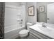 Bright bathroom featuring a shower/tub combination, a toilet, and a white vanity with a mirror at 197 Glen Hollow Dr, Raleigh, NC 27604