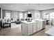 Open-concept living area seamlessly blends into kitchen and dining room; lots of natural light at 197 Glen Hollow Dr, Raleigh, NC 27604
