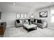 Cozy living room with comfortable seating, neutral colors, and modern decor at 197 Glen Hollow Dr, Raleigh, NC 27604