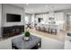 Open-concept living space with TV, kitchen, and dining areas, ideal for Gathering gatherings at 197 Glen Hollow Dr, Raleigh, NC 27604