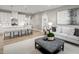 Open-concept living space features a kitchen island with bar stools and comfortable seating at 197 Glen Hollow Dr, Raleigh, NC 27604
