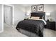 Comfortable bedroom with cozy dark-toned furnishings at 197 Glen Hollow Dr, Raleigh, NC 27604