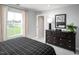 Cozy bedroom with dresser, and plenty of natural light at 197 Glen Hollow Dr, Raleigh, NC 27604