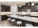 Modern kitchen with sleek cabinetry, a spacious island, and stainless steel appliances, ideal for cooking enthusiasts at 198 Glen Hollow Dr, Raleigh, NC 27604