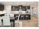 Modern kitchen with stainless steel appliances, island with seating, and dining area, perfect for entertaining at 198 Glen Hollow Dr, Raleigh, NC 27604