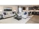 Inviting living room with neutral tones, comfortable seating, and an open layout connecting to the kitchen and dining area at 198 Glen Hollow Dr, Raleigh, NC 27604