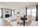 Cozy living room featuring a fireplace, comfortable seating, and large windows that fill the space with natural light at 198 Glen Hollow Dr, Raleigh, NC 27604