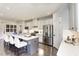 Modern kitchen featuring stainless steel appliances, sleek countertops, and a stylish center island with seating at 199 Glen Hollow Dr, Raleigh, NC 27604