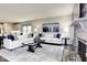 Bright living room showcasing a comfortable seating area, stylish decor, and a decorative stone fireplace at 199 Glen Hollow Dr, Raleigh, NC 27604
