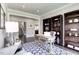 Cozy home office with hardwood floors, stylish rug, and built-in bookshelves at 199 Glen Hollow Dr, Raleigh, NC 27604