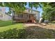 Beautiful backyard with a screened porch, patio, and stairs, perfect for outdoor living at 2027 River Grove Ln, Knightdale, NC 27545