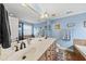 Bright primary bathroom features double sinks, tile accents, and a large mirror at 2027 River Grove Ln, Knightdale, NC 27545