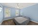 Cozy bedroom with carpet flooring, ceiling fan, and natural light makes it a perfect place to unwind and relax at 2027 River Grove Ln, Knightdale, NC 27545