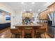 Kitchen island with granite countertops, stainless steel appliances and seating at 2027 River Grove Ln, Knightdale, NC 27545