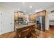 Well-appointed kitchen with a center island, stainless steel appliances, and hardwood floors at 2027 River Grove Ln, Knightdale, NC 27545
