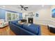 Warm living room with a fireplace, hardwood floors, and comfortable seating at 2027 River Grove Ln, Knightdale, NC 27545