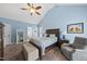Inviting main bedroom with vaulted ceilings, chair, and ensuite bathroom at 2027 River Grove Ln, Knightdale, NC 27545
