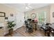 Comfortable home office with two windows, a modern desk, and dual seating provides an ideal work environment at 2027 River Grove Ln, Knightdale, NC 27545