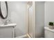 Clean bathroom with a walk-in shower, single sink vanity, and a stylish mirror, offering a modern and functional space at 205 Northfield Dr, Raleigh, NC 27609