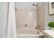Bathroom featuring tiled shower with adjustable shower head and pink tiling at 205 Northfield Dr, Raleigh, NC 27609
