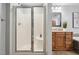 Bathroom featuring glass enclosed shower and wooden vanity at 205 Northfield Dr, Raleigh, NC 27609
