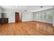 Bright bedroom with hardwood floors, built-in shelves, and large windows at 205 Northfield Dr, Raleigh, NC 27609