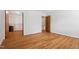 Spacious bedroom with hardwood floors and a walk-in closet, providing ample storage and comfort at 205 Northfield Dr, Raleigh, NC 27609