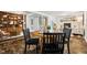 Inviting dining area featuring a round table, fireplace, and a built-in bookcase, perfect for cozy dinners at 205 Northfield Dr, Raleigh, NC 27609