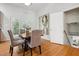 Dining room with hardwood floors, gray chairs, and french doors at 205 Northfield Dr, Raleigh, NC 27609