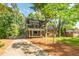 Charming home with brick and siding exterior, complemented by a well-maintained driveway at 205 Northfield Dr, Raleigh, NC 27609