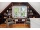 Bright home office featuring built-in shelving, a window, and two chairs at 205 Northfield Dr, Raleigh, NC 27609