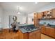 An open concept kitchen and dining area featuring stainless appliances and a gas cooktop on the island at 205 Northfield Dr, Raleigh, NC 27609
