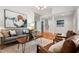 Living room with modern furniture, light gray sofa, and hardwood floors at 205 Northfield Dr, Raleigh, NC 27609