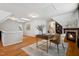 Cozy living room featuring a gas fireplace, natural lighting, and hardwood flooring at 205 Northfield Dr, Raleigh, NC 27609