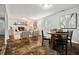 Living room with cozy fireplace and an adjacent dining area at 205 Northfield Dr, Raleigh, NC 27609