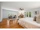 Spacious bedroom with hardwood floors, ceiling fan, and large windows for natural lighting at 205 Northfield Dr, Raleigh, NC 27609