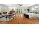 Spacious bedroom with hardwood floors, ceiling fan, and large windows for natural lighting at 205 Northfield Dr, Raleigh, NC 27609