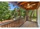 View of the cozy screened-in porch overlooking backyard and wooded views at 205 Northfield Dr, Raleigh, NC 27609
