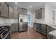 Well-equipped kitchen with stainless steel appliances, granite countertops, and ample cabinet space at 2057 Big Falls Dr, Wendell, NC 27591