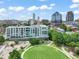 Aerial view of community buildings, skate park, and green space with a beautiful skyline in the background at 214 Hunt St # 701, Durham, NC 27701