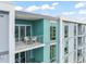 Exterior view of a balcony with wicker chairs and a table, perfect for outdoor relaxing at 214 Hunt St # 701, Durham, NC 27701