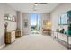 Bright bedroom with floor to ceiling windows, two desk spaces, and modern decor at 214 Hunt St # 701, Durham, NC 27701