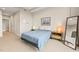 Comfortable bedroom with nightstands, mirror, and bright natural lighting at 214 Hunt St # 701, Durham, NC 27701