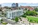 Contemporary apartment building in an urban setting, with balconies and a nearby park at 214 Hunt St # 701, Durham, NC 27701